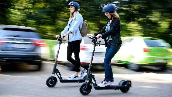girls riding scooters img