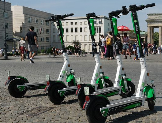 girls riding scooters img